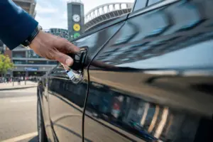 Professional chauffeur opening the door for guests attending FIFA 2026 in Seattle