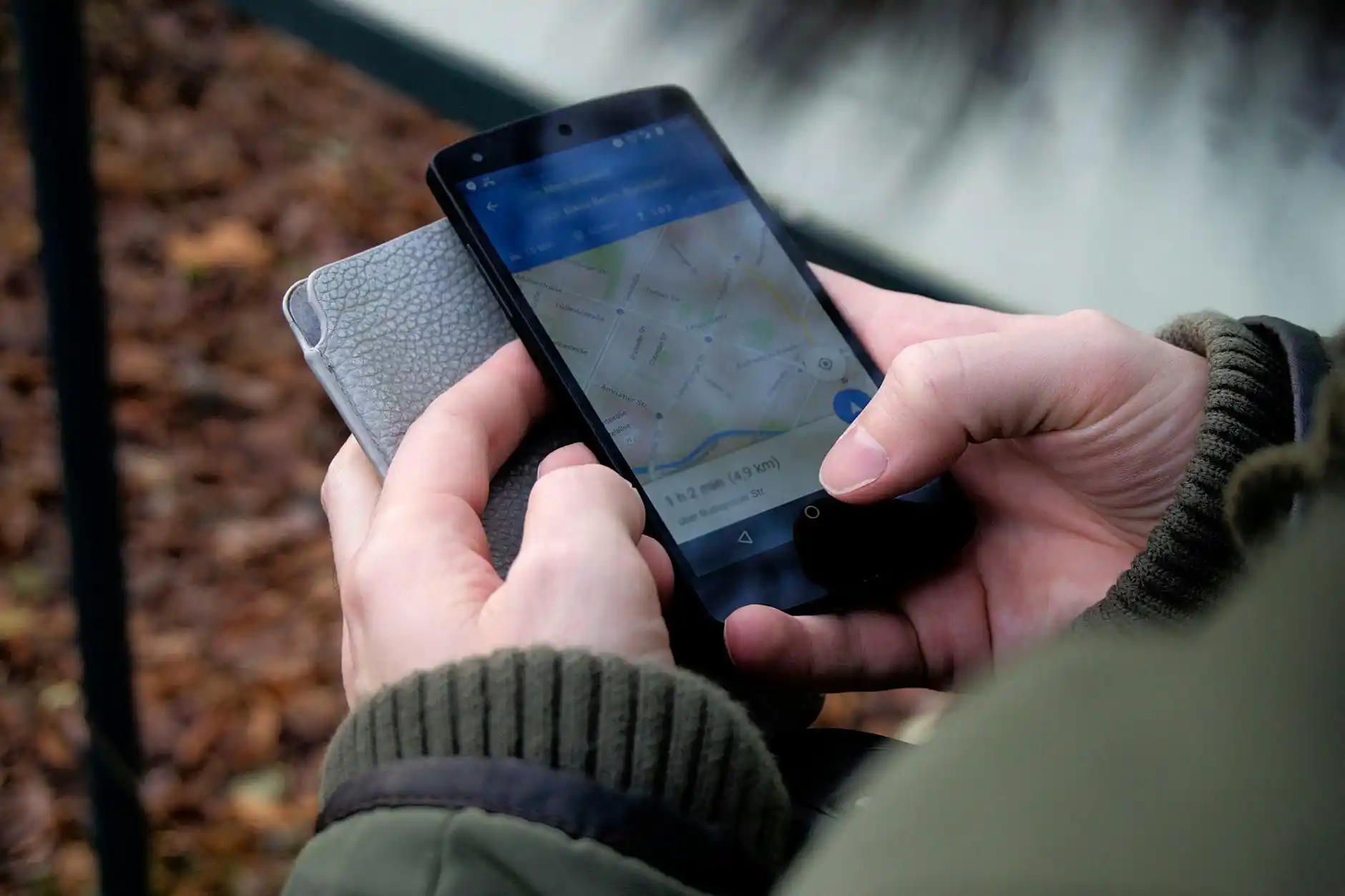 close-up of a luxury transportation reservation sheet on a clipboard with a smartphone, pen, and Seattle street map on a polished wood desk in a modern office