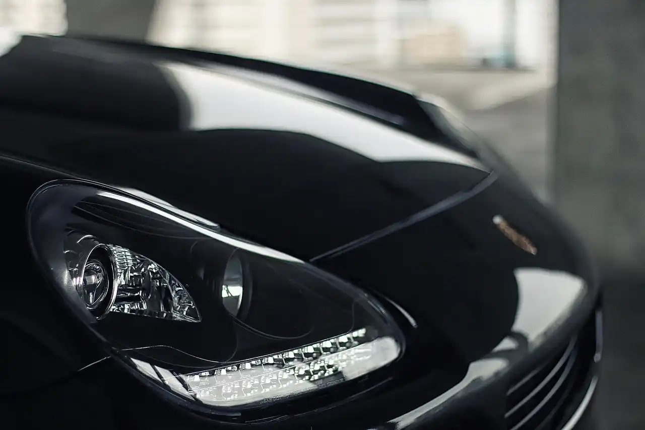 professional chauffeur in a black luxury SUV greeting travelers at Seattle-Tacoma airport arrivals with name sign, rolling luggage, bright terminal lighting, realistic business ...