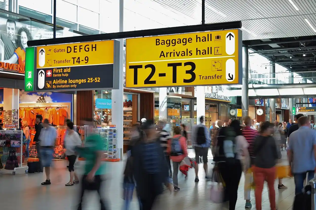 split scene showing early morning airport drop-off traffic on one side and crowded evening arrivals pickup lane on the other, with planes overhead and digital clock overlays